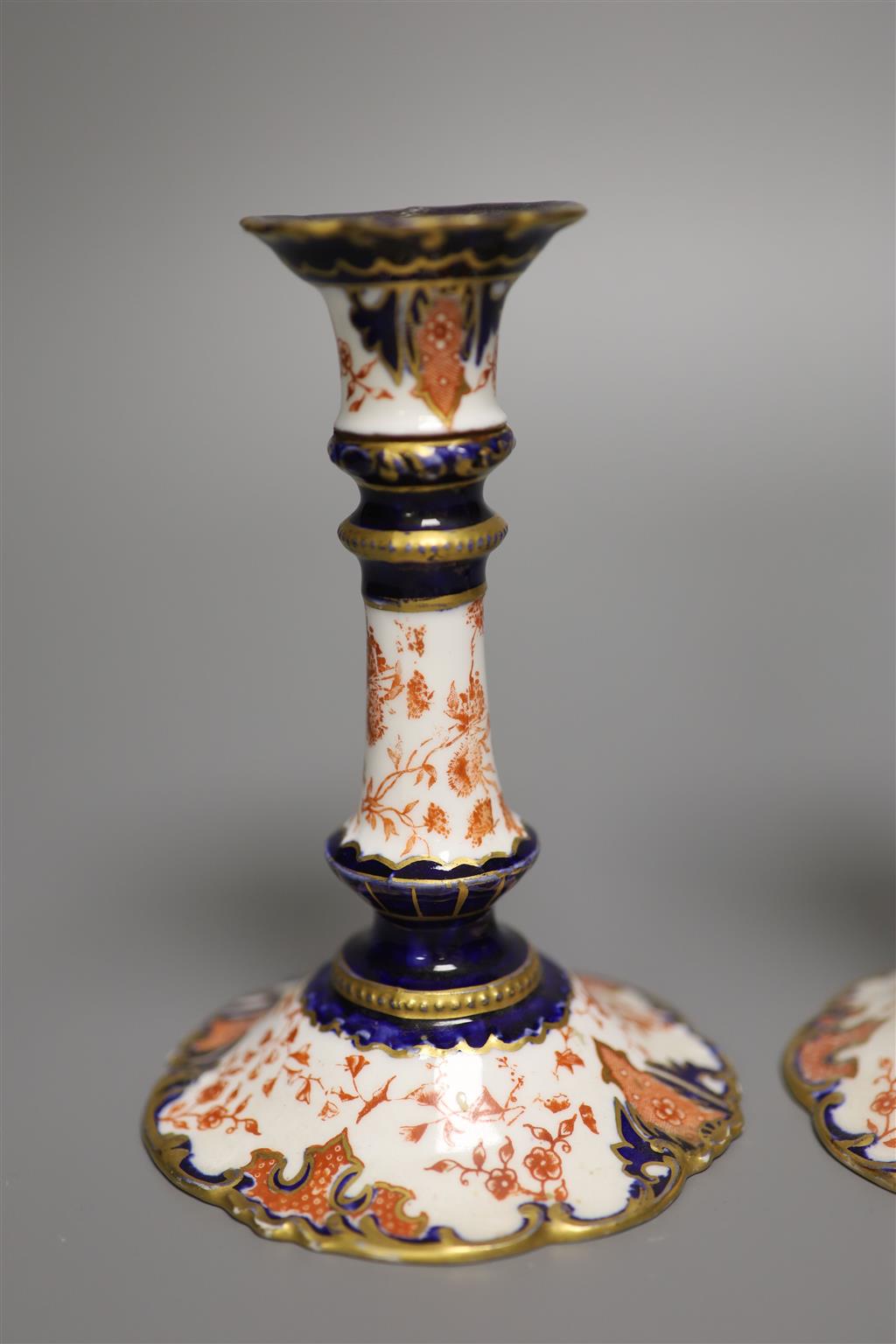 A pair of Royal Crown Derby candlesticks, height 15cm